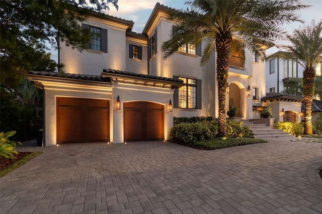 mediterranean / spanish-style house featuring a garage