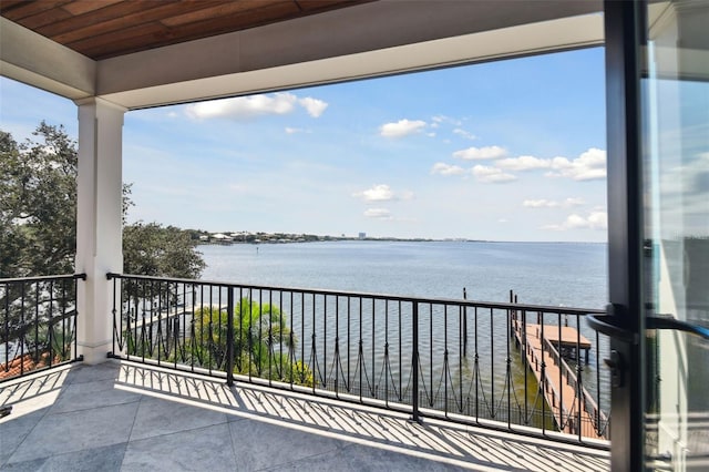 balcony featuring a water view