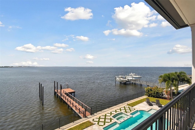5120 W Longfellow Ave, Tampa, FL 33629 - dock with a water view, a pool with connected hot tub, and a patio