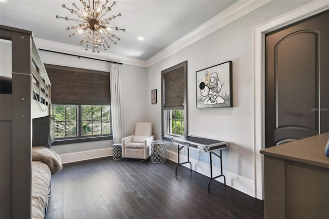 sitting room with dark hardwood / wood-style flooring, ornamental molding, and a chandelier