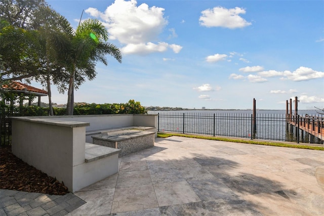 view of patio featuring a water view