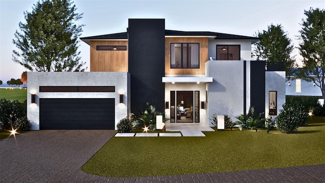 contemporary home with a yard and a garage