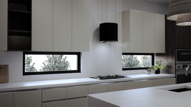 kitchen featuring white cabinets, oven, and gas stovetop