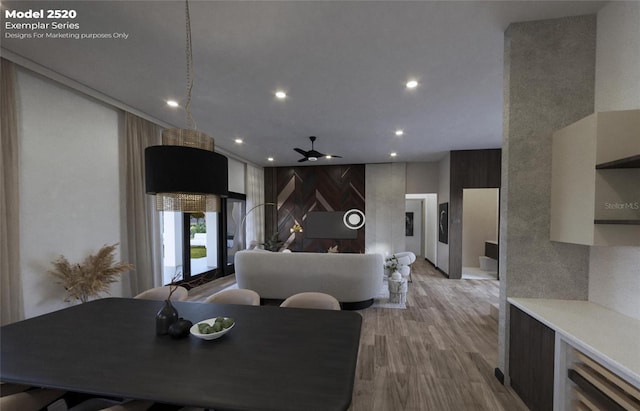 dining room with light hardwood / wood-style floors and ceiling fan