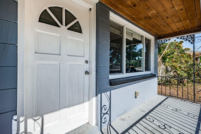 doorway to property featuring covered porch