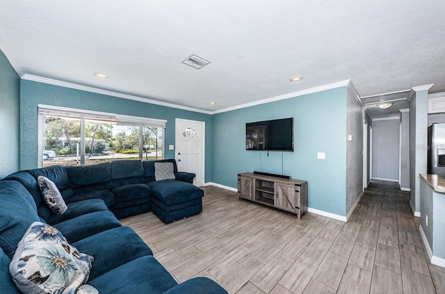 living room with a textured ceiling and ornamental molding