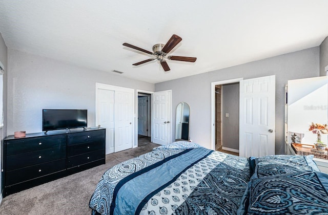 bedroom featuring ceiling fan, a closet, and carpet floors