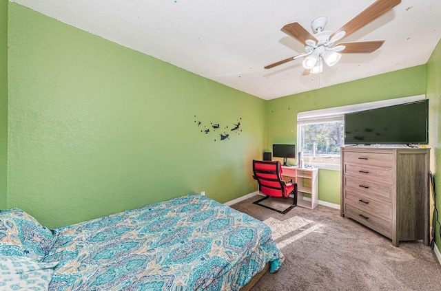 bedroom with ceiling fan and light colored carpet