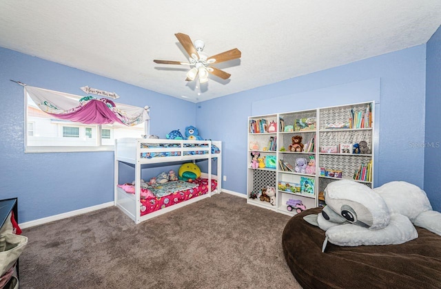 carpeted bedroom featuring a textured ceiling and ceiling fan