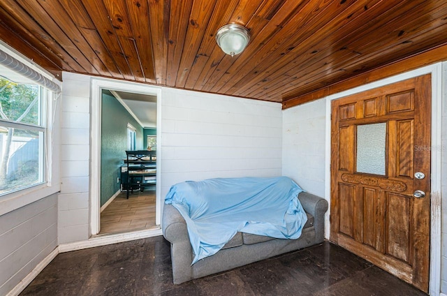 sitting room featuring wood walls and wood ceiling