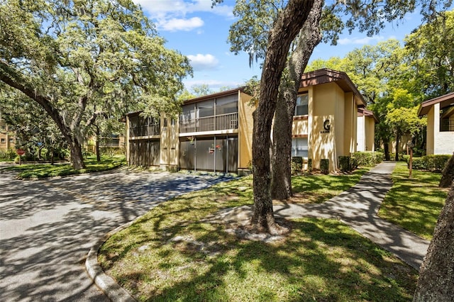 view of front of property with a balcony