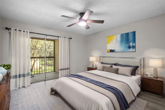 bedroom featuring access to exterior, a textured ceiling, light hardwood / wood-style floors, and ceiling fan