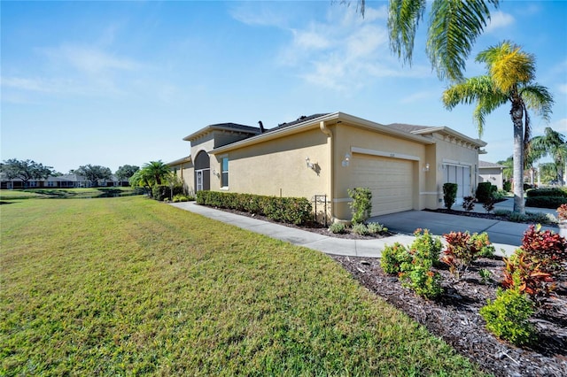 view of property exterior featuring a yard and a garage