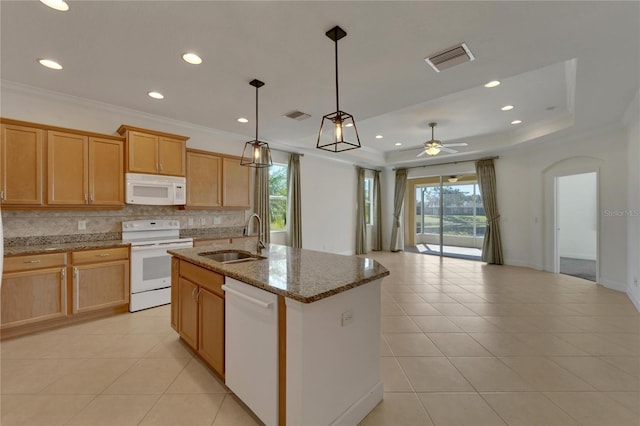 kitchen with white appliances, ceiling fan, sink, light tile patterned floors, and an island with sink