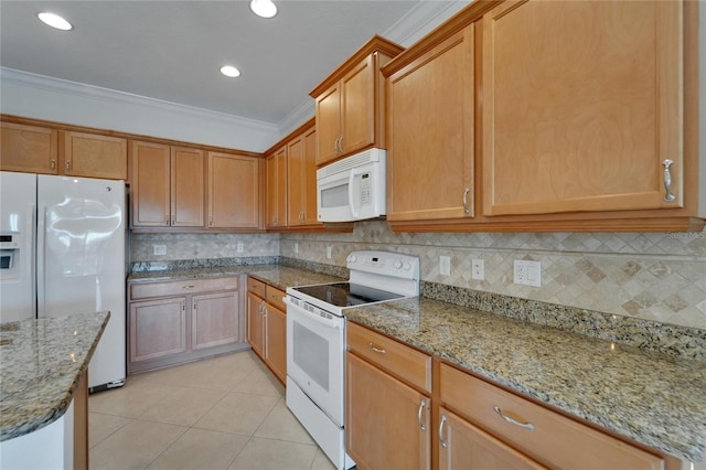 kitchen with light stone counters, light tile patterned flooring, white appliances, and ornamental molding