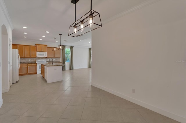 kitchen featuring white appliances, crown molding, pendant lighting, light tile patterned floors, and a center island