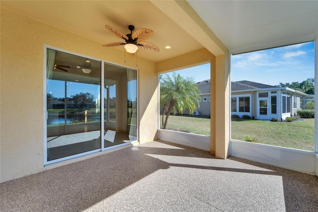 unfurnished sunroom with a water view