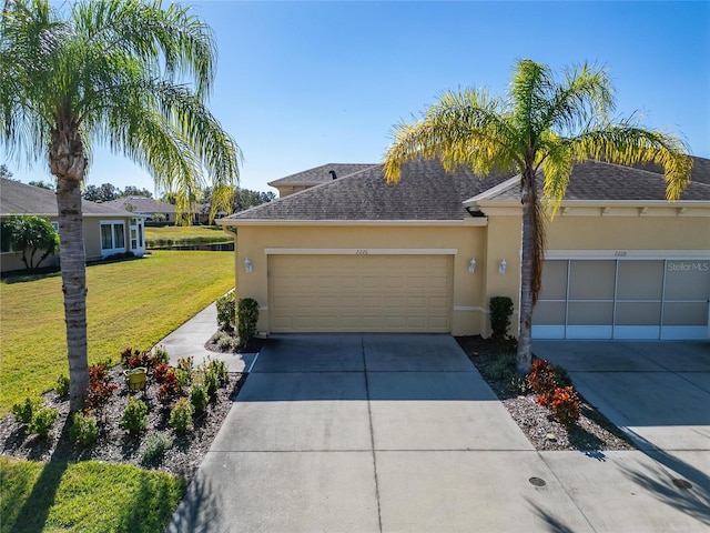 ranch-style home featuring a garage and a front lawn