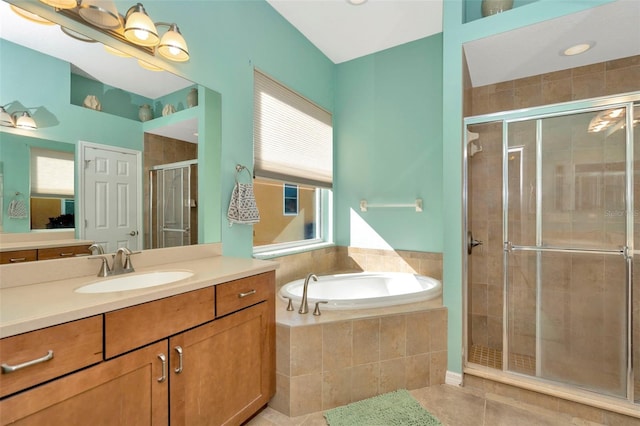 bathroom with vanity, tile patterned floors, and independent shower and bath