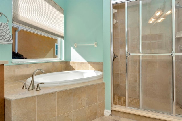 bathroom featuring plus walk in shower