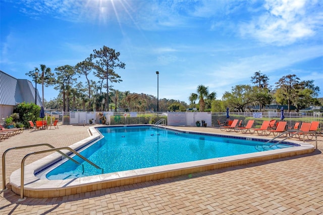 view of swimming pool with a patio