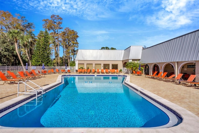 view of pool featuring a patio area