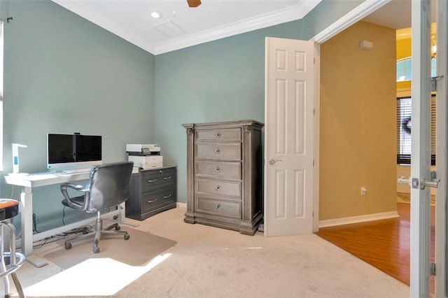 carpeted office featuring ornamental molding and ceiling fan