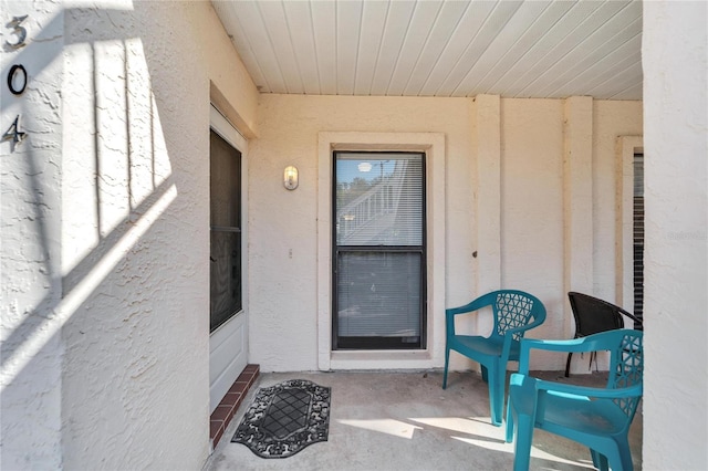 doorway to property featuring a patio area