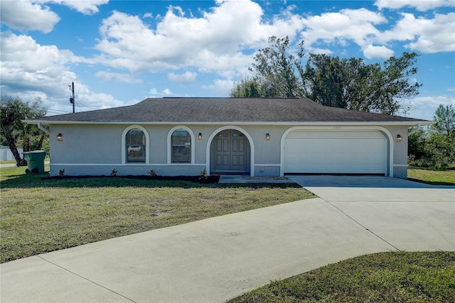 single story home featuring a front yard and a garage