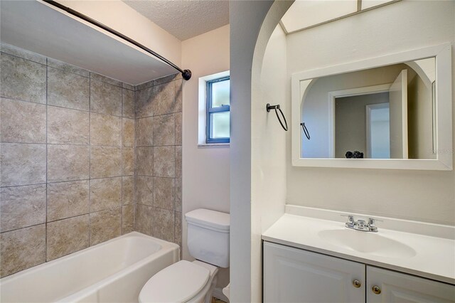 11339 Gulfstream Blvd, Port Charlotte, FL 33981 - full bath with vanity, shower / bathtub combination, and a textured ceiling