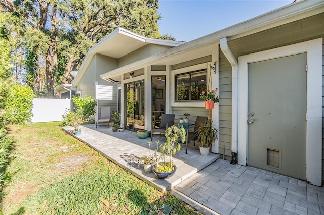 back of property featuring a patio