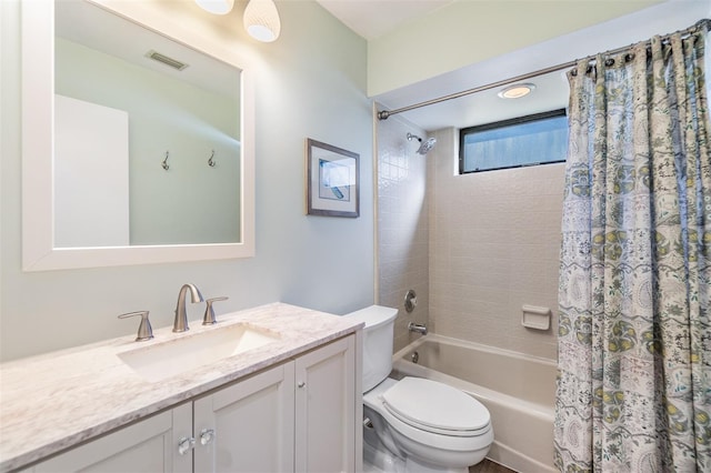 14631 Village Glen Cir, Tampa, FL 33618 - bathroom featuring toilet, shower / bath combo with shower curtain, and vanity