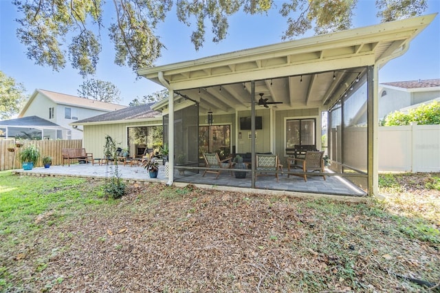 14631 Village Glen Cir, Tampa, FL 33618 - rear view of property featuring ceiling fan, a patio area, board and batten siding, and a sunroom