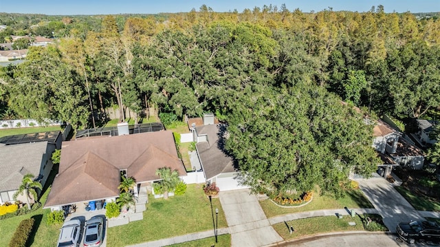 14631 Village Glen Cir, Tampa, FL 33618 - aerial view of property and surrounding area featuring a heavily wooded area and nearby suburban area