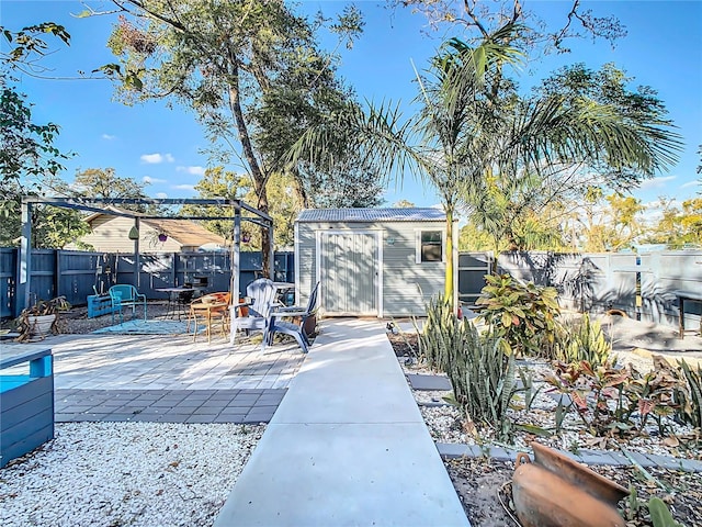 view of patio / terrace featuring a shed