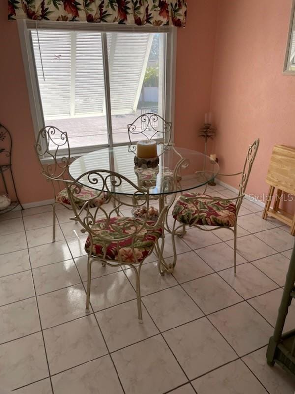 dining room with light tile patterned floors