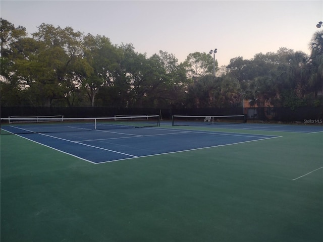 4199 38th Ave S Unit I, Saint Petersburg, FL 33711 - view of tennis court featuring community basketball court and view of wooded area