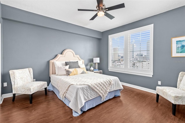 bedroom featuring ceiling fan and dark hardwood / wood-style flooring