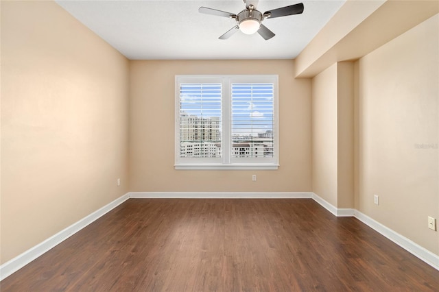 unfurnished room featuring dark hardwood / wood-style floors and ceiling fan