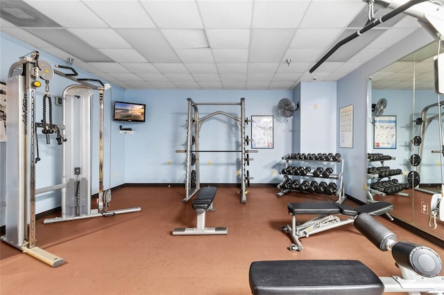 gym featuring a paneled ceiling