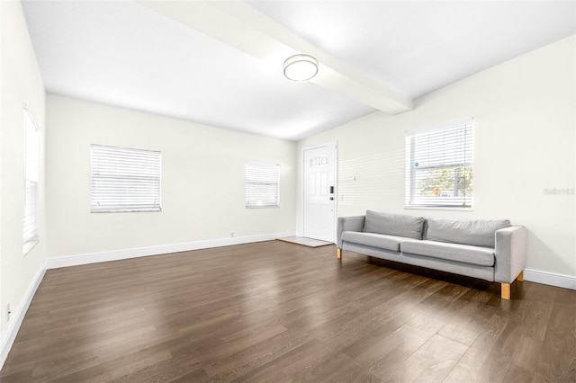 living room with dark wood-type flooring and lofted ceiling with beams