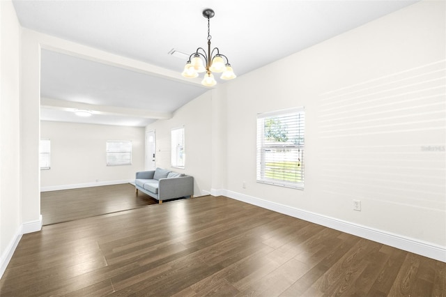 interior space with an inviting chandelier, dark hardwood / wood-style floors, and beamed ceiling