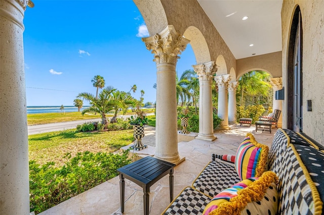 view of patio featuring a water view