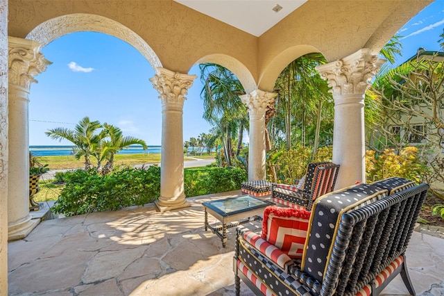 view of patio with a water view