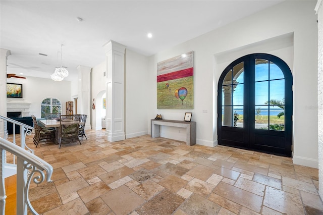 entryway with ceiling fan and french doors