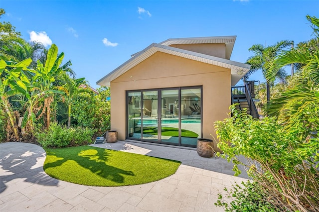 back of house featuring a patio area