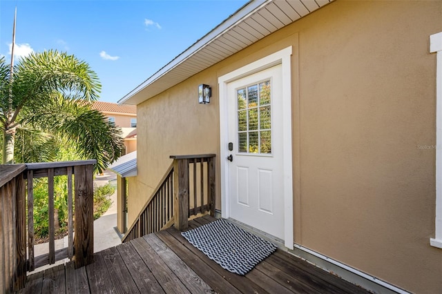 doorway to property with a wooden deck