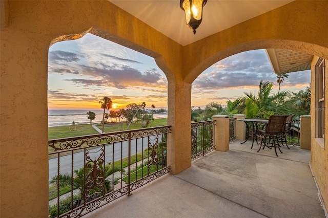 balcony at dusk with a water view