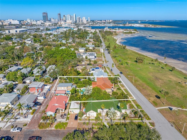 drone / aerial view featuring a view of the beach and a water view