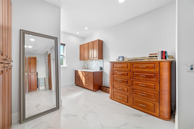 bathroom featuring tasteful backsplash and sink